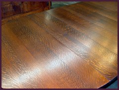 View of the table top with the leaves installed, illustrating the striking, yet not garrish, quarter-sawn "ray-flake" grain.